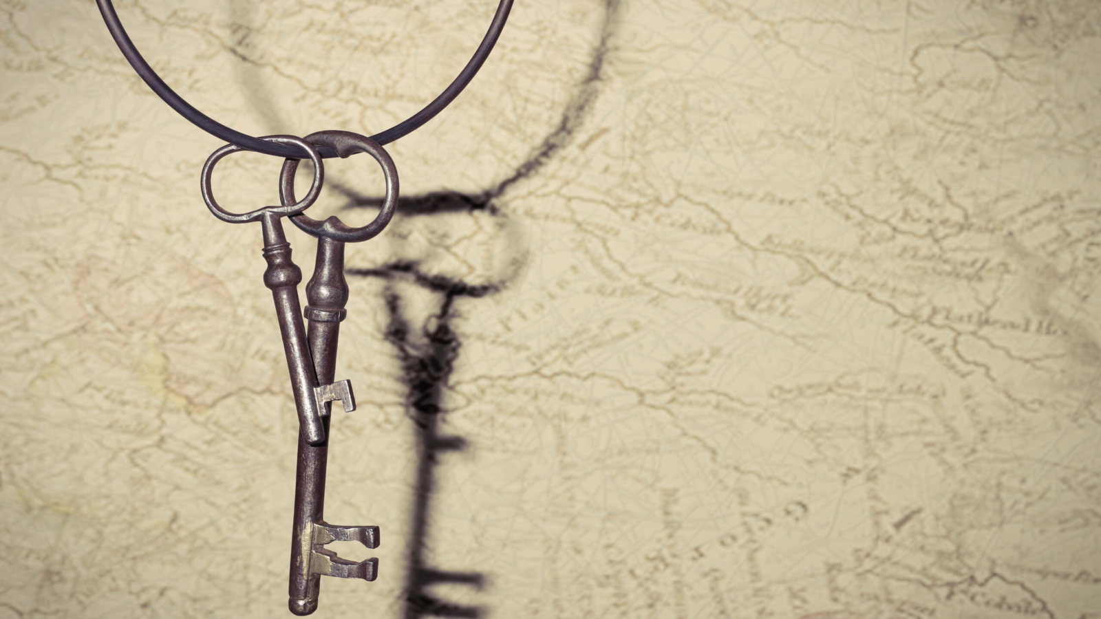 Old antique vintage key on rustic background